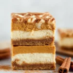 Delicious Pumpkin Cheesecake Bars on a White Plate