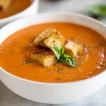 Warm Creamy Tomato Basil Soup in a Rustic Bowl