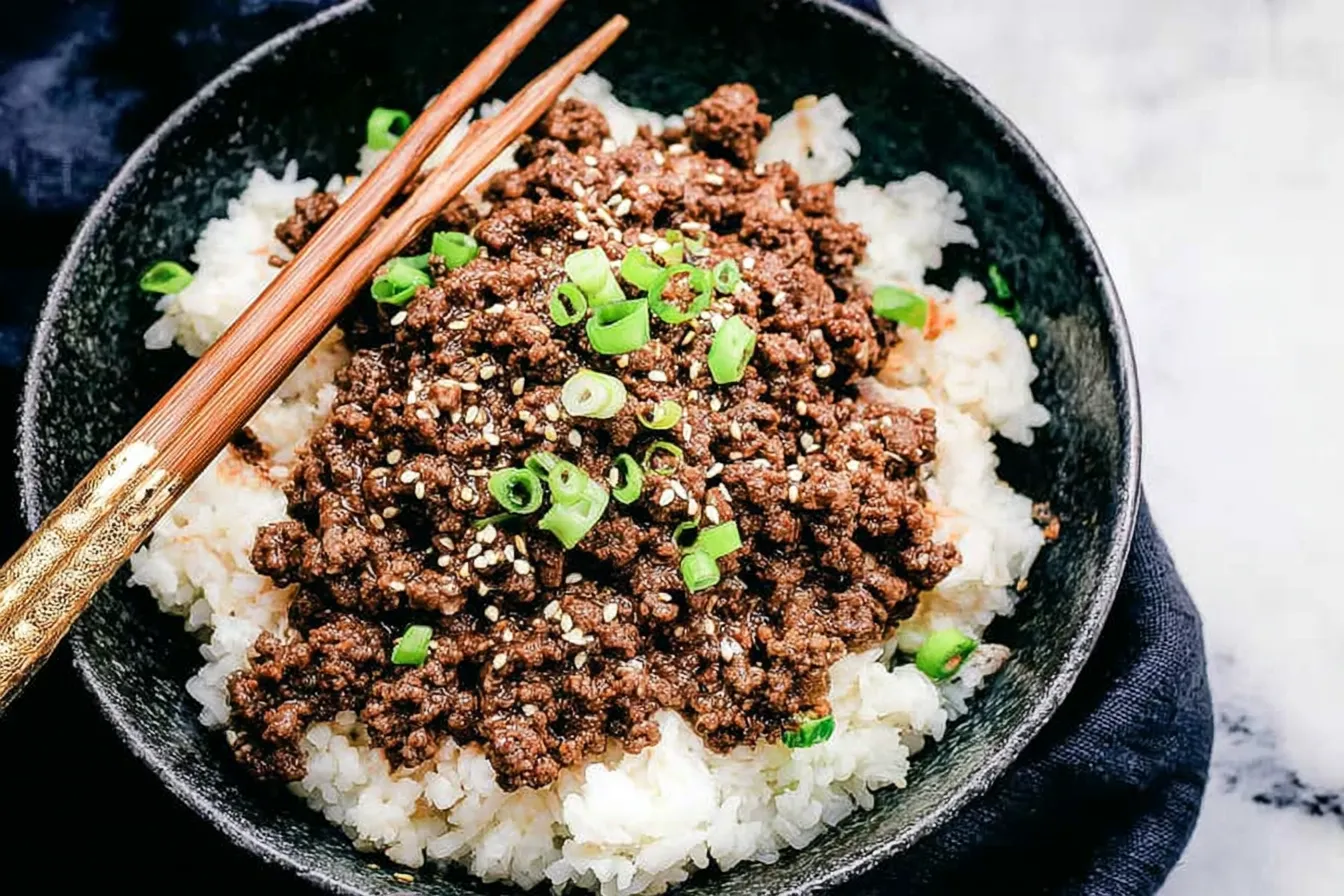 Korean Ground Beef Bowls — Soy glaze with rice and sesame seeds 2 Korean Ground Beef Bowls — Soy glaze with rice and sesame seeds