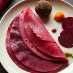 Beetroot Dosa on a Plate