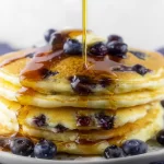 Buttermilk Blueberry Pancakes: A Delightful Breakfast Treat 3 Fluffy Buttermilk Blueberry Pancakes Ready to Serve