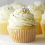 Vanilla Cupcakes Topped with Creamy Frosting