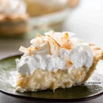 Coconut Cream Pie: Delightfully Creamy and Irresistible Goodness 3 Delicious Coconut Cream Pie Slices on a Plate
