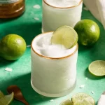 Coconut Lime Mocktail: Refreshing and Delicious Twist 3 Coconut Lime Mocktail in a Glass with Lime Wedge
