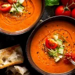 Chilled Gazpacho Soup Garnished with Fresh Herbs