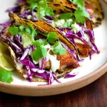 Crispy Fish Tacos with Cabbage Slaw: A Flavor Explosion! 3 Crispy Fish Tacos with Cabbage Slaw in a Colorful Spread
