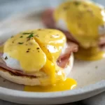 Delicious Eggs Benedict Plate with Fresh Garnish