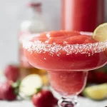 Frozen Strawberry Margarita Slushie in a Glass with Straw