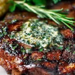 Grilled Ribeye Steak with Herb Butter on a Plate