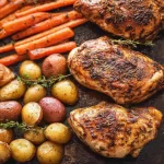 One-Pan Roast Chicken with Potatoes and Carrots Served Hot