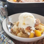 Delicious Peach Cobbler with Vanilla Ice Cream