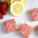 Strawberry Lemonade Bars: A Refreshing Summer Treat 3 Refreshing Strawberry Lemonade Bars on a Plate