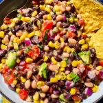 Cowboy Caviar: A Flavorful Twist You'll Love 3 Cowboy Caviar in a Bowl with Fresh Ingredients