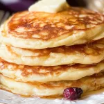 Fluffy Buttermilk Pancakes You'll Love Every Morning 3 Fluffy Buttermilk Pancakes on a Plate