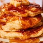 Delicious Homemade Pancakes Stacked with Syrup