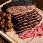 Smoked Beef Brisket: The Ultimate Flavor Explosion! 3 Delicious Smoked Beef Brisket on Wooden Cutting Board