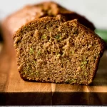Zucchini Bread: Deliciously Moist and Perfect for Any Day 3 Freshly Baked Zucchini Bread on a Wooden Board