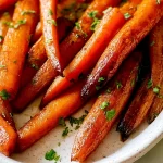 Maple Roasted Carrots on a Plate with Fresh Herbs