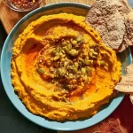 Creamy Pumpkin Hummus in a Bowl with Fresh Veggies